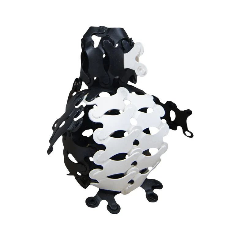 Black and white Binabo chips put together in the shape of a penguin