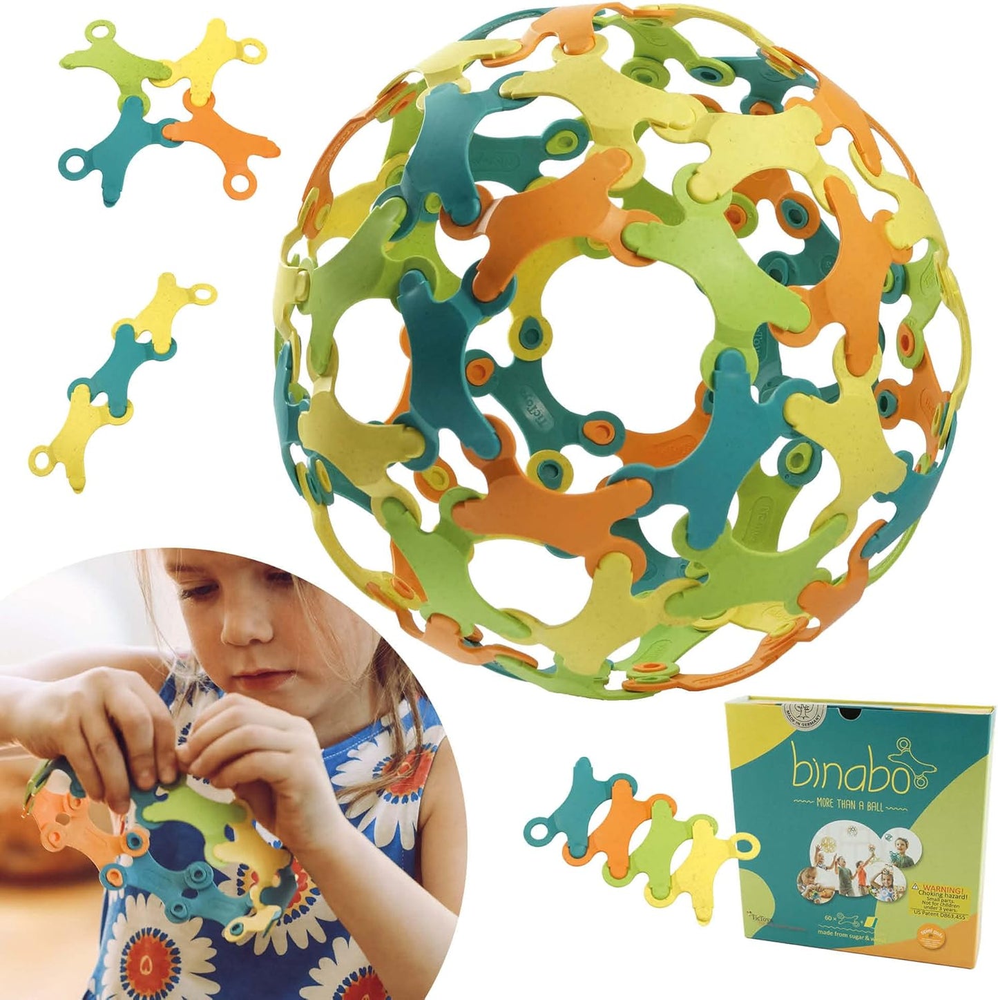 Binabo multicolored interlocking ball toy surrounded by loose pieces and a child playing with it.
