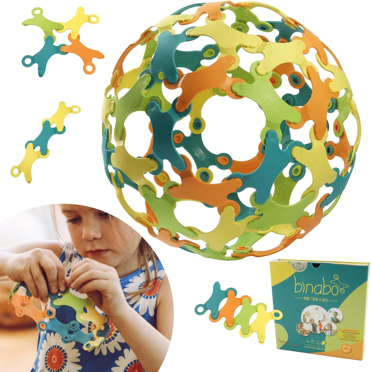 Binabo multicolored interlocking ball toy surrounded by loose pieces and a child playing with it.