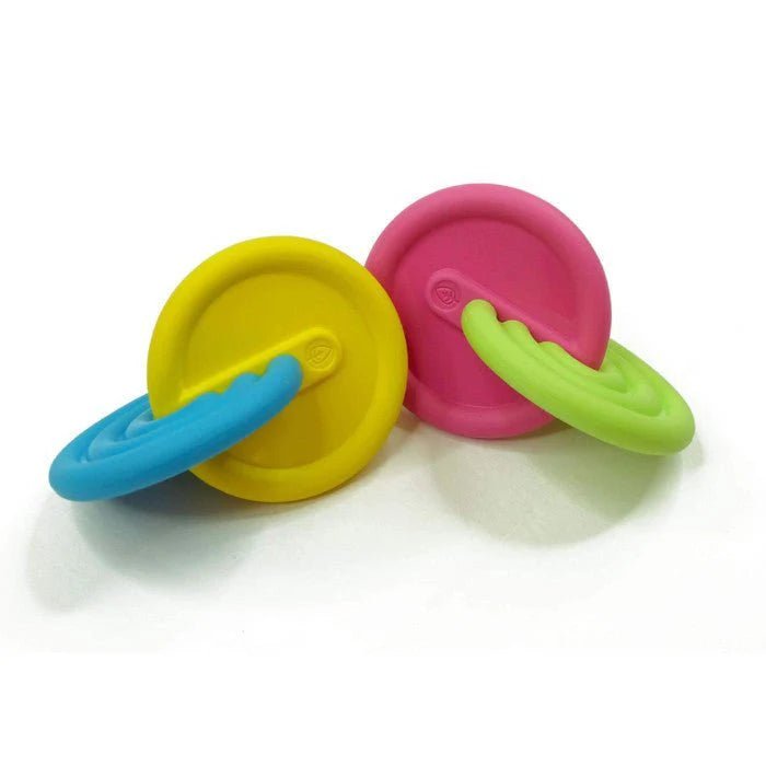 Pair of colorful interlocking silicone discs on a white background
