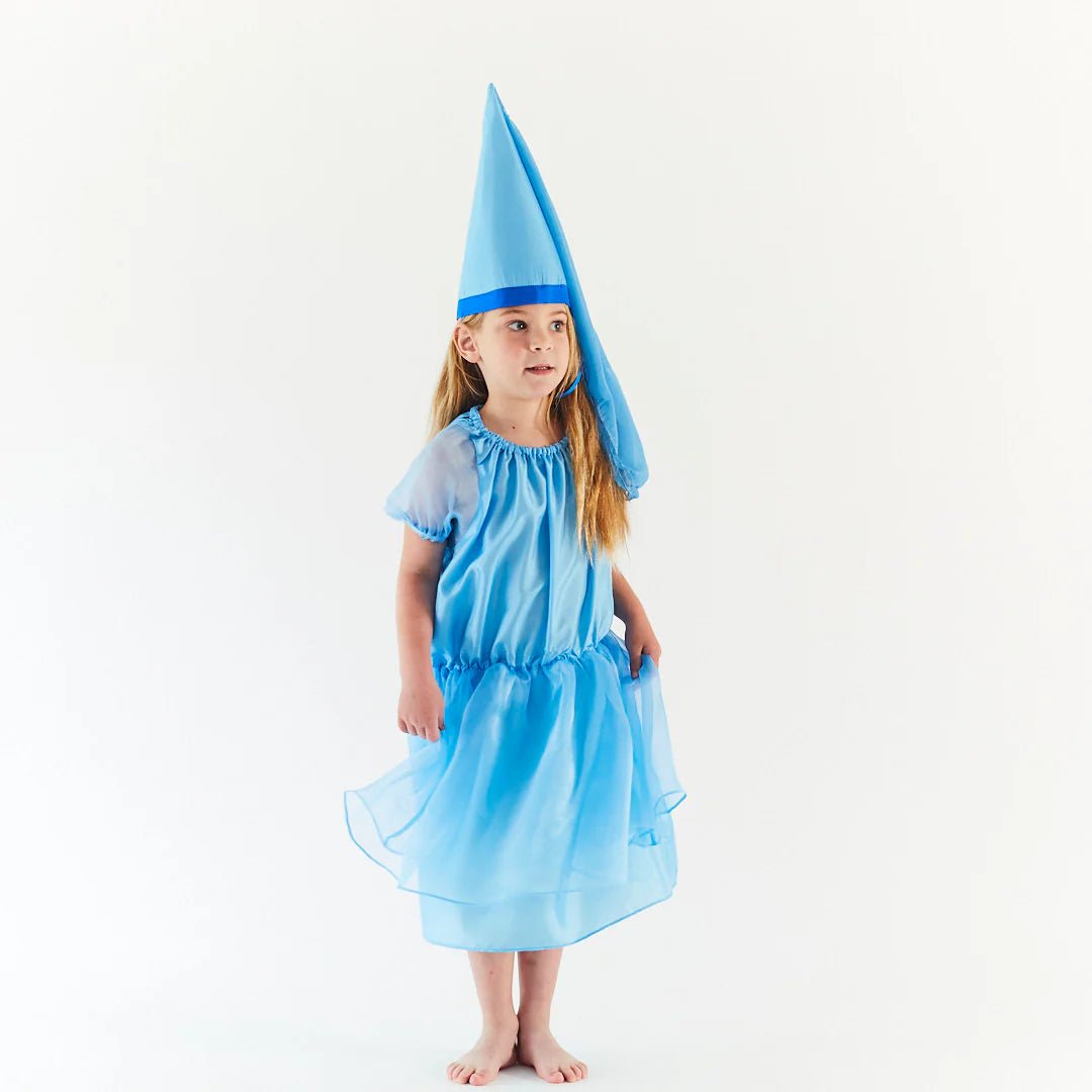 Child wearing a blue dress with a matching pointed hat on a white background