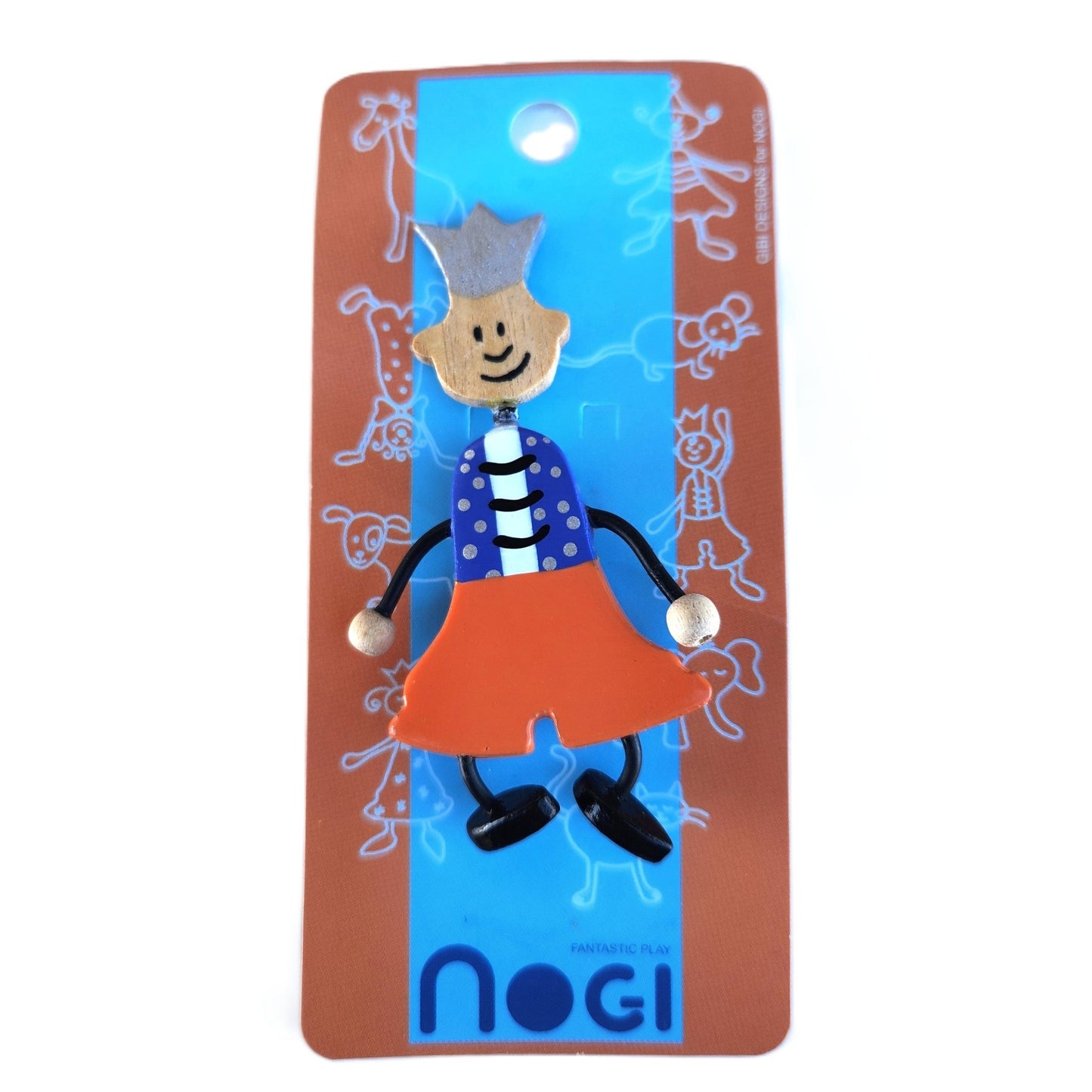 Wooden pin of a boy wearing a blue vest, orange pants, and a silver crown on Nogi branded packaging