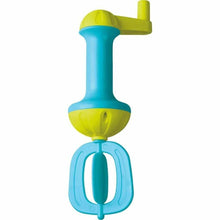 Blue and green bubble bath whisk on a white background