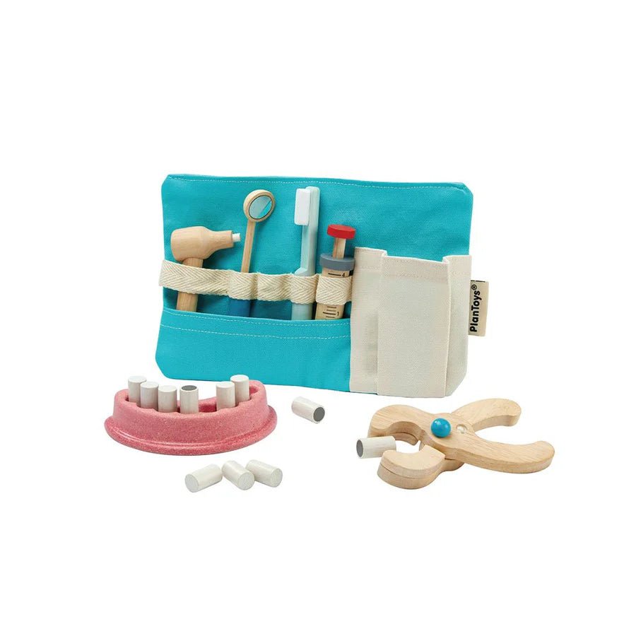 Set of wooden dental tools including a blue pouch, toothbrush, and other accessories on a white background.