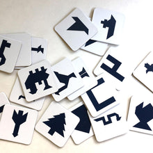 Set of white cards with black symbols on a light background