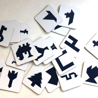 Set of white cards with black symbols on a light background