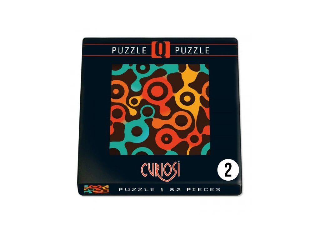 Puzzle box with colorful design and 'Curiosi' branding on a white background