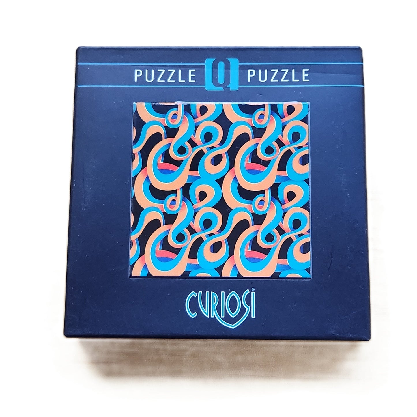 Curiosi abstract q puzzle on a white background