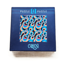 Curiosi abstract q puzzle on a white background