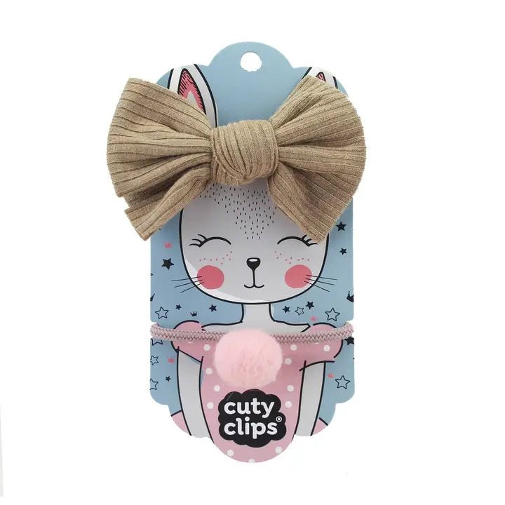 Cuty Clips beige and pink hair bands with branded packaging on a white background