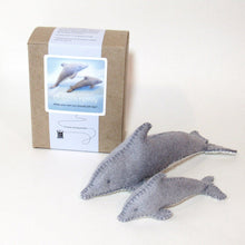 Dolphin family sewing kit with two felt dolphins on a white background