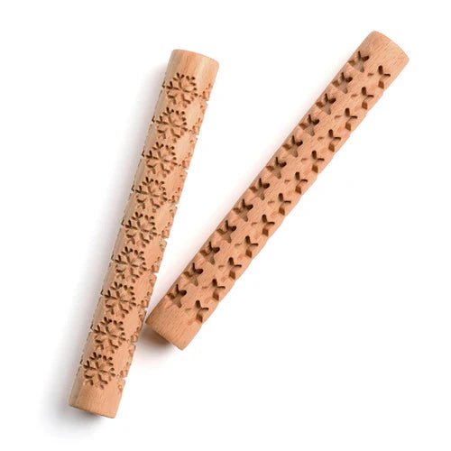 Two wooden Eco-Dough rollers with embossed patterns on a white background, one of snowflakes, one of stars