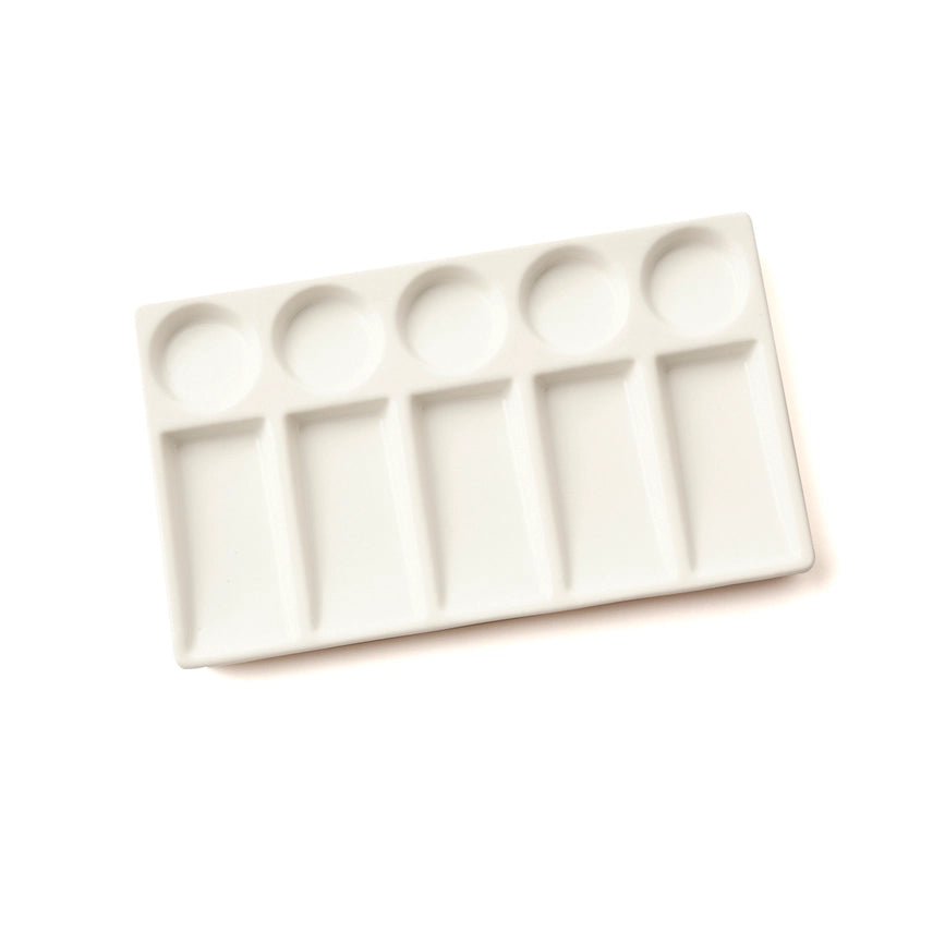 White ceramic paint palette on a white background