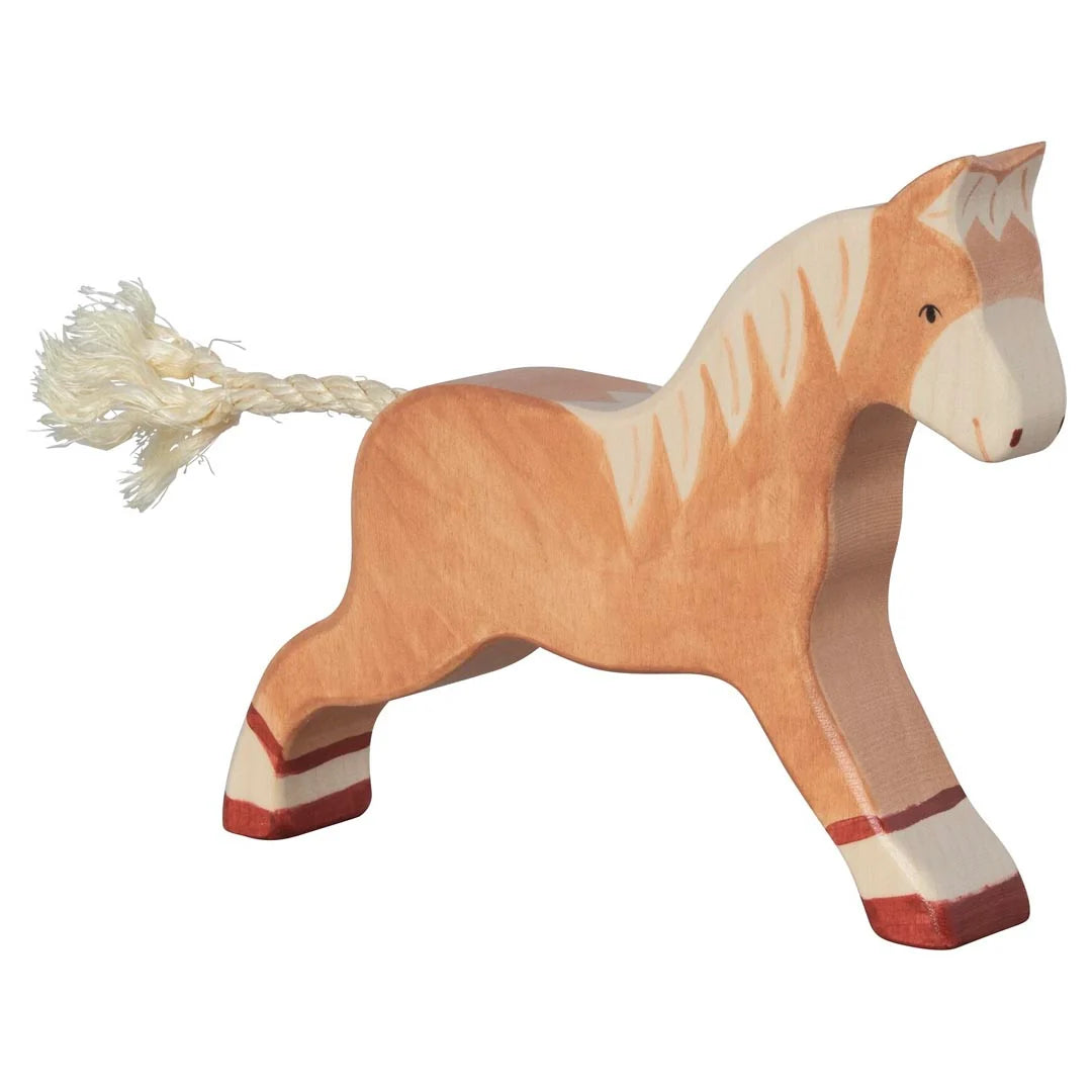Wooden horse toy with a white mane on a white background