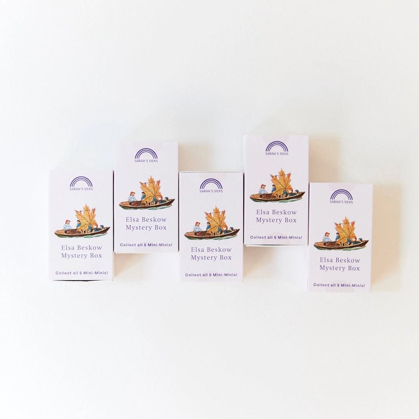 Five identical boxes of Elsa Beskow Mystery Box on a white background