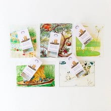 Five illustrated mystery box cards arranged on a white background, each with a small hanging card labeled 'Elsa Beskow Mystery Box' and a corresponding illustrated envelope behind it.