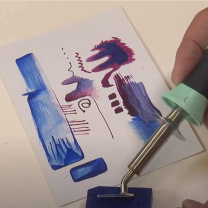 Hand holding Encaustic Art Stylus Pro with Rectangular tip showing different strokes and effects