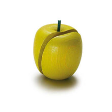 Wooden green apple on a white background