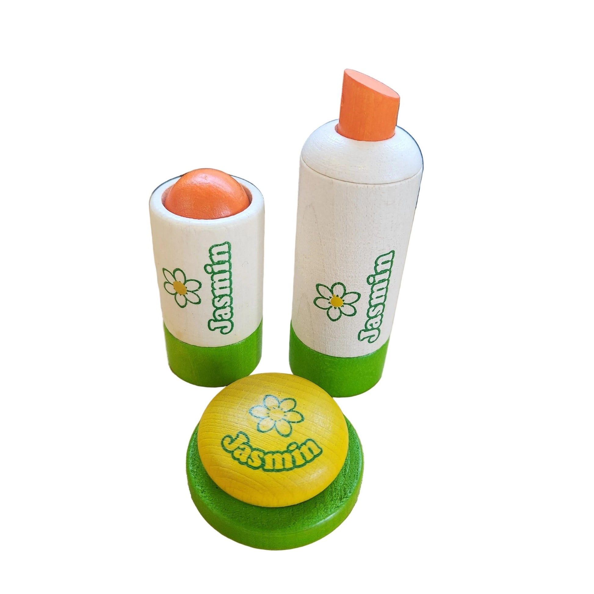 Play set with spray bottle, deodorant, and soap dish on a white background