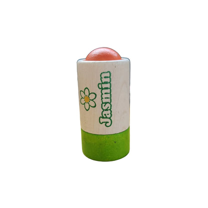 Wooden play roll-on deodorant labeled Jasmine on a white background