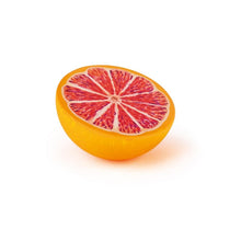 Wooden grapefruit half facing up on a white background