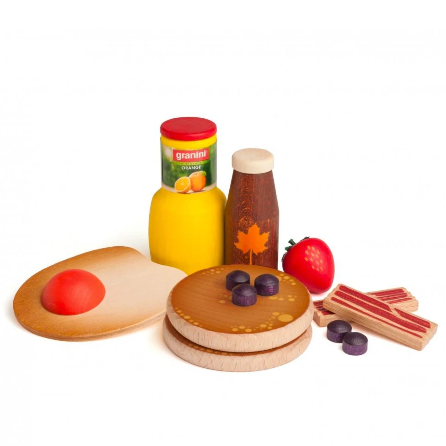 A wooden pretend-play kitchen food play set on a white background, featuring a fried egg, pancakes, blueberries, an orange juice bottle, a maple syrup bottle, bacon pieces, and a strawberry.