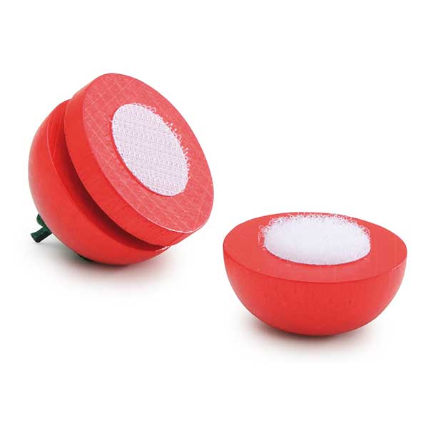 Wooden tomato with velcro slices on a white background
