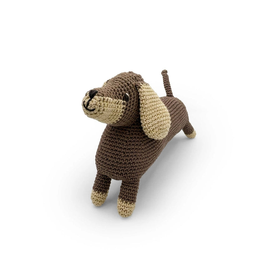 Crocheted dachshund stuffed toy on a white background