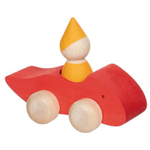 Red wooden vehicle with a yellow gnome peg person on a white background