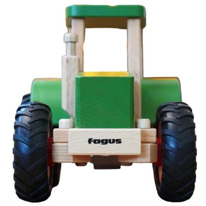 Rear view of wooden toy tractor with 'fagus' branding on a white background
