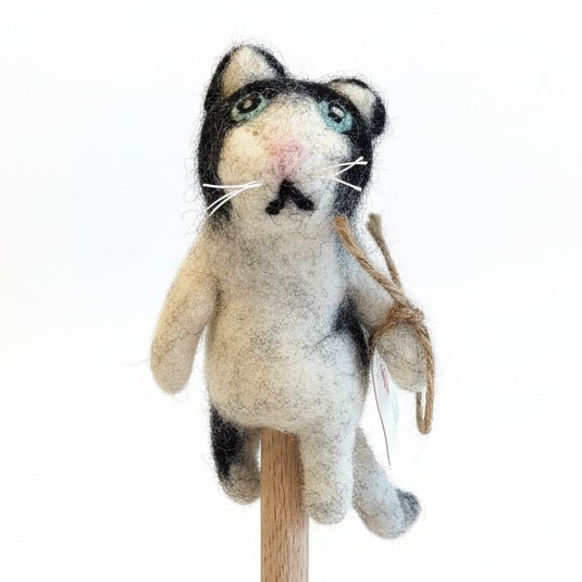 Black and white cat finger puppet on a white background