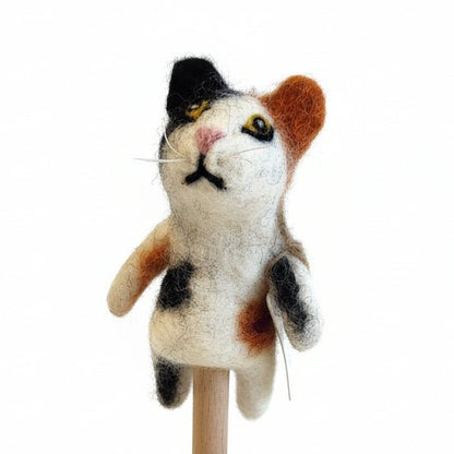 Black, white, and orange cat finger puppet on a white background
