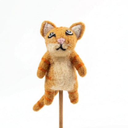 Orange felted cat finger puppet on a dowel against a black background
