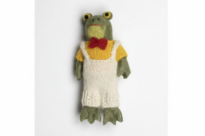 Knitted frog toy with a yellow sweater and red bow tie on a white background