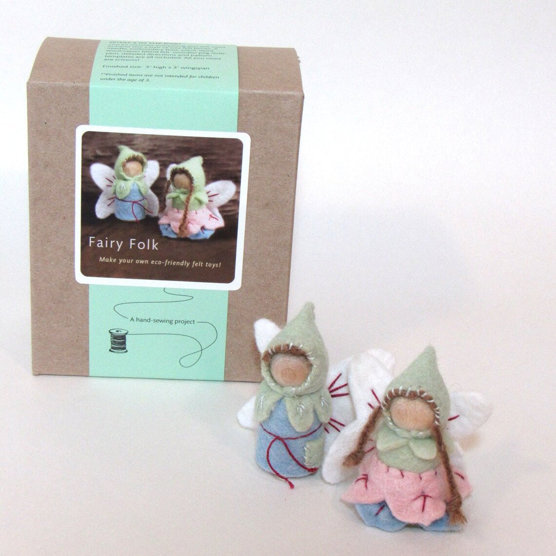 Fairy-themed craft kit with felt fairy dolls and packaging on a white background
