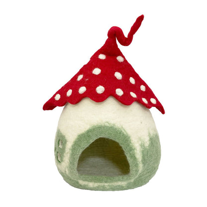 Mushroom cave with red-polka dot roof on a white background