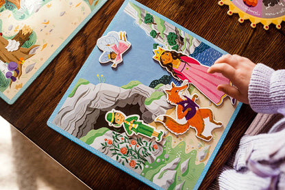 Children's board game with fairy tale characters on a wooden table