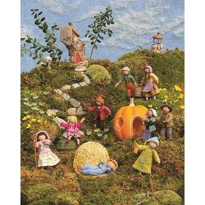 Illustration of children playing in a fantasy garden with pumpkins and fairy tale elements.
