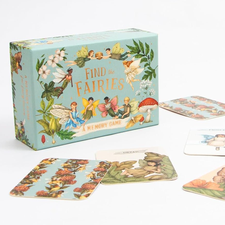 Children's card game with fairy-themed cards and box on a white background