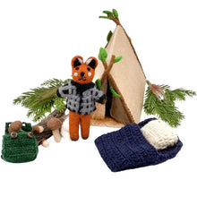 Felted fox with a sweater, tent, and sleeping bag on a white background