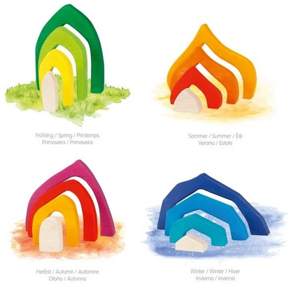 Set of four colorful wooden rainbow-shaped houses with labels for each season on a white background.