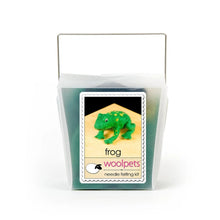 Frosted plastic box containing materials to make a needle felted frog with woolpets branding on a white background