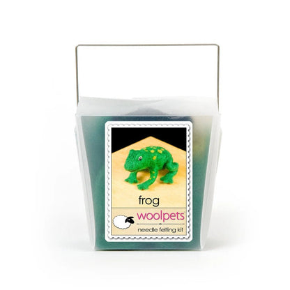 Frosted plastic box containing materials to make a needle felted frog with woolpets branding on a white background