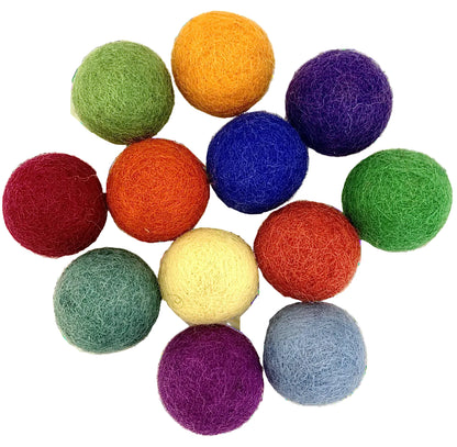 Pile of 12 felt balls in different colors 
