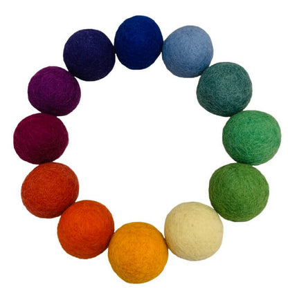 12 colors of felt balls arranged in a circle
