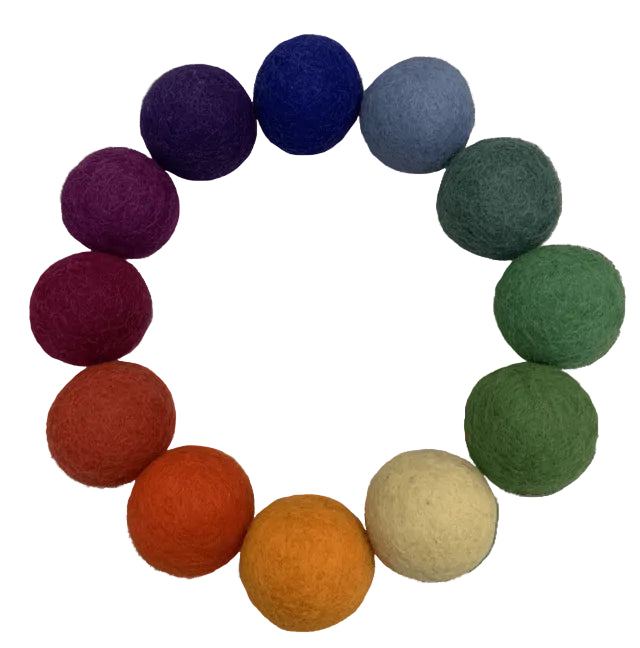 12 different colored felt balls arranged in a circle