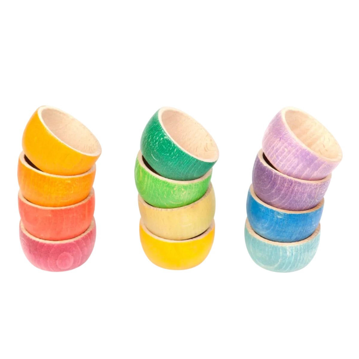 12 colorful wooden bowls arranged in rainbow order on a white background