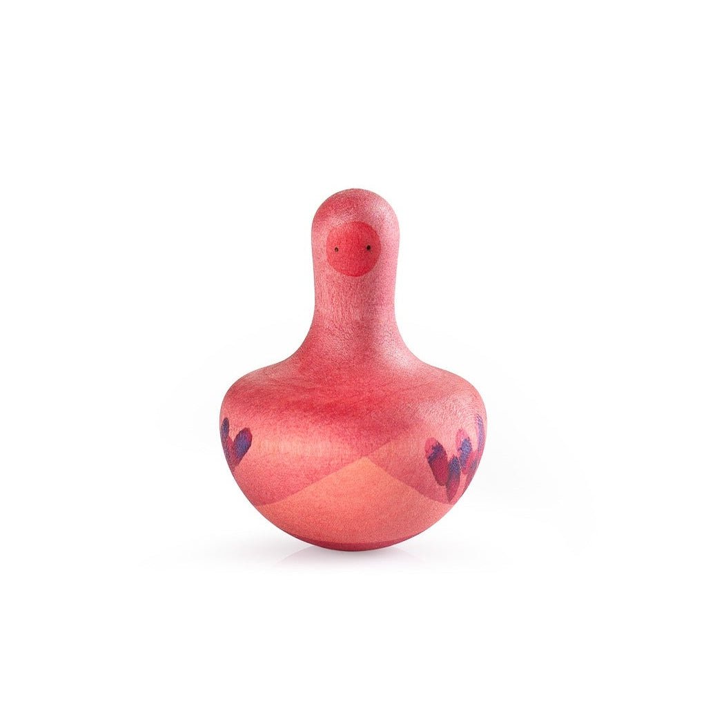 Pink rocking toy with purple accents on a white background