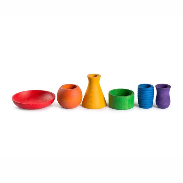 Set of colorful wooden containers on a white background