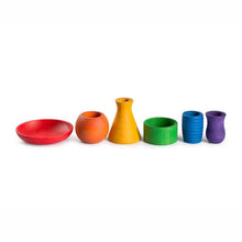 Set of colorful wooden containers on a white background